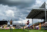 30 April 2023; Conor Cooney of Galway scores a point despite the attention of David Blanchfield of Kilkenny during the Leinster GAA Hurling Senior Championship Round 2 match between Kilkenny and Galway at UPMC Nowlan Park in Kilkenny. Photo by Harry Murphy/Sportsfile
