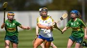30 April 2023; Aine Byrne of Wicklow in action against Kathryn Ryan, left, and Ciara O'Sullivan of Kerry during the Electric Ireland Camogie Minor C All-Ireland Championship Semi Final match between Kerry and Wicklow at St. Flannan's Park in Moneygall, Tipperary. Photo by Tom Beary/Sportsfile