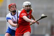 30 April 2023; Pamela Mackey of Cork in action against Beth Carton of Waterford during the Munster Senior Camogie Championship Quarter Final match between Cork and Waterford at Páirc Uí Chaoimh in Cork. Photo by Brendan Moran/Sportsfile