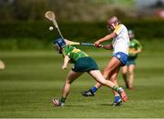 30 April 2023; Ciara Wafer of Wicklow in action against Ruth O'Connor of Kerry during the Electric Ireland Camogie Minor C All-Ireland Championship Semi Final match between Kerry and Wicklow at St. Flannan's Park in Moneygall, Tipperary. Photo by Tom Beary/Sportsfile