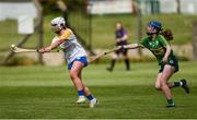 30 April 2023; Ciara Lancaster of Wicklow in action against Kathryn Ryan of Kerry during the Electric Ireland Camogie Minor C All-Ireland Championship Semi Final match between Kerry and Wicklow at St. Flannan's Park in Moneygall, Tipperary. Photo by Tom Beary/Sportsfile