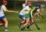 30 April 2023; Emma Conway of Kerry in action against Aoife Campbell, left, and Holly Byrne of Wicklow during the Electric Ireland Camogie Minor C All-Ireland Championship Semi Final match between Kerry and Wicklow at St. Flannan's Park in Moneygall, Tipperary. Photo by Tom Beary/Sportsfile