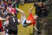 30 April 2023; Andrew Murnin of Armagh collides with Down goalkeeper Niall Kane during the Ulster GAA Football Senior Championship Semi Final match between Armagh and Down at St Tiernach’s Park in Clones, Monaghan. Photo by Ramsey Cardy/Sportsfile