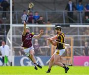 30 April 2023; Darragh Corcoran of Kilkenny scores a point, under pressure from his opposite number Cianan Fahy of Galway,  during the Leinster GAA Hurling Senior Championship Round 2 match between Kilkenny and Galway at UPMC Nowlan Park in Kilkenny. Photo by Ray McManus/Sportsfile
