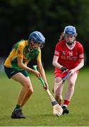 30 April 2023; Dearbhla Porter of Donegal in action against Catherine Moohan of Tyrone during the Electric Ireland Camogie Minor C All-Ireland Championship Shield Final match between Donegal and Tyrone at Tír na nÓg Randalstown in Antrim. Photo by Stephen Marken/Sportsfile
