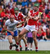 30 April 2023; Brian Roche of Cork scores a point despite the efforts of Jack Fagan of Waterford during the Munster GAA Hurling Senior Championship Round 2 match between Cork and Waterford at Páirc Uí Chaoimh in Cork. Photo by Brendan Moran/Sportsfile