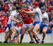 30 April 2023; Brian Roche of Cork is tackled by Waterford players Jamie Barron, Conor Prunty and Jack Fagan during the Munster GAA Hurling Senior Championship Round 2 match between Cork and Waterford at Páirc Uí Chaoimh in Cork. Photo by Brendan Moran/Sportsfile
