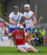 30 April 2023; Ger Mellerick of Cork is tackled by Jamie Barron and Neil Montgomery of Waterford during the Munster GAA Hurling Senior Championship Round 2 match between Cork and Waterford at Páirc Uí Chaoimh in Cork. Photo by Brendan Moran/Sportsfile