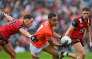 30 April 2023; Jemar Hall of Armagh in action against Ryan Johnston of Down during the Ulster GAA Football Senior Championship Semi Final match between Armagh and Down at St Tiernach’s Park in Clones, Monaghan. Photo by Ramsey Cardy/Sportsfile
