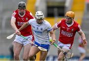 30 April 2023; Dessie Hutchinson of Waterford is tackled by Robert Downey, left, an Niall O'Leary of Cork during the Munster GAA Hurling Senior Championship Round 2 match between Cork and Waterford at Páirc Uí Chaoimh in Cork. Photo by Brendan Moran/Sportsfile