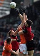 30 April 2023; Pat Havern, left, and Conor Poland of Down in action against Connaire Mackin, left, and Shane McPartlan of Armagh during the Ulster GAA Football Senior Championship Semi Final match between Armagh and Down at St Tiernach’s Park in Clones, Monaghan. Photo by Ramsey Cardy/Sportsfile