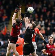 30 April 2023; Andrew Murnin of Armagh scores his side's third goal, despite pressure from Down players Ryan McEvoy, left, and goalkeeper Niall Kane during the Ulster GAA Football Senior Championship Semi Final match between Armagh and Down at St Tiernach’s Park in Clones, Monaghan. Photo by Ramsey Cardy/Sportsfile