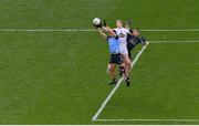 30 April 2023; Daniel Flynn of Kildare in action against Dublin players David Byrne, left, and goalkeeper Stephen Cluxton during the Leinster GAA Football Senior Championship Semi Final match between Dublin and Kildare at Croke Park in Dublin. Photo by Seb Daly/Sportsfile