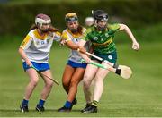30 April 2023; Roisin Quinn of Kerry in action against Ciara Connolly, left, and Aine Byrne of Wicklow during the Electric Ireland Camogie Minor C All-Ireland Championship Semi Final match between Kerry and Wicklow at St. Flannan's Park in Moneygall, Tipperary. Photo by Tom Beary/Sportsfile
