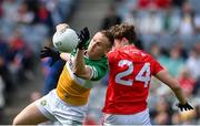 30 April 2023; Declan Hogan of Offaly in action against Dylan McKeown of Louth during the Leinster GAA Football Senior Championship Semi Final match between Louth and Offaly at Croke Park in Dublin. Photo by Seb Daly/Sportsfile