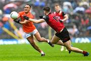 30 April 2023; Jemar Hall of Armagh in action against Patrick Branagan of Down during the Ulster GAA Football Senior Championship Semi Final match between Armagh and Down at St Tiernach’s Park in Clones, Monaghan. Photo by Ramsey Cardy/Sportsfile