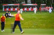 01 May 2023; A train passes as Sophie McMahon of Scorchers bowls during the Evoke T20 Super Series 2023 match between Scorchers and Dragons at Malahide Cricket Club in Dublin. Photo by David Fitzgerald/Sportsfile