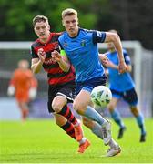 1 May 2023; Jack Keaney of UCD in action against John Martin of Dundalk during the SSE Airtricity Men's Premier Division match between UCD and Dundalk at UCD Bowl in Dublin. Photo by Stephen Marken/Sportsfile