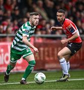 1 May 2023; Jack Byrne of Shamrock Rovers in action against Michael Duffy of Derry City during the SSE Airtricity Men's Premier Division match between Derry City and Shamrock Rovers at The Ryan McBride Brandywell Stadium in Derry. Photo by Ramsey Cardy/Sportsfile