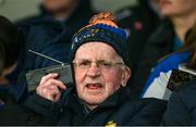 23 April 2023; Clare GAA President Pádraic Mac Mathúna, Éire Óg, listens to his radio before the Munster GAA Hurling Senior Championship Round 1 match between Clare and Tipperary at Cusack Park in Ennis, Clare. Photo by Ray McManus/Sportsfile