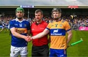 23 April 2023; Referee Thomas Walsh with the two captains, Noel McGrath of Tipperary and Tony Kelly of Clare, before the Munster GAA Hurling Senior Championship Round 1 match between Clare and Tipperary at Cusack Park in Ennis, Clare. Photo by Ray McManus/Sportsfile