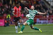 1 May 2023; Sadou Diallo of Derry City is tackled by Richie Towell of Shamrock Rovers during the SSE Airtricity Men's Premier Division match between Derry City and Shamrock Rovers at The Ryan McBride Brandywell Stadium in Derry. Photo by Ramsey Cardy/Sportsfile
