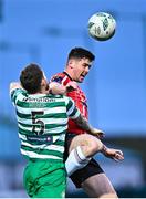 1 May 2023; Cian Kavanagh of Derry City in action against Lee Grace of Shamrock Rovers during the SSE Airtricity Men's Premier Division match between Derry City and Shamrock Rovers at The Ryan McBride Brandywell Stadium in Derry. Photo by Ramsey Cardy/Sportsfile