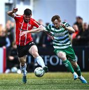 1 May 2023; Cian Kavanagh of Derry City is tackled by Sean Hoare of Shamrock Rovers during the SSE Airtricity Men's Premier Division match between Derry City and Shamrock Rovers at The Ryan McBride Brandywell Stadium in Derry. Photo by Ramsey Cardy/Sportsfile