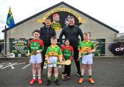 2 May 2023; At the launch of The Dillon Quirke Foundation fundraising in association with The Circet All-Ireland GAA Golf Challenge at the Clonoulty-Rossmore GAA Club in Tipperary is children from Clonoulty and Rossmore schools, from left, Rian Quinn, aged nine, Scott Wood, aged ten, Hazel Rayn, aged nine and Jamie O'Sullivan, aged eight, with inter-county hurling managers, Darren Gleeson of Antrim and Darragh Egan of Wexford. The Foundation are calling on all GAA clubs to provide €100 towards providing cardiac screening across the association. To donate, visit bit.ly/doitfordillon. Photo by Harry Murphy/Sportsfile