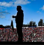 30 April 2023; Supporters are seen behind a silhoutte of Waterford manager Davy Fitzgerald during the Munster GAA Hurling Senior Championship Round 2 match between Cork and Waterford at Páirc Uí Chaoimh in Cork. Photo by David Fitzgerald/Sportsfile