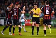 5 May 2023; Bohemians players, from left, Declan McDaid, Adam McDonnell and James Clarke protest to referee Rob Hennessy during the SSE Airtricity Men's Premier Division match between Shamrock Rovers and Bohemians at Tallaght Stadium in Dublin. Photo by Tyler Miller/Sportsfile