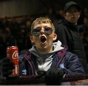 5 May 2023; A young Drogheda United supporter sings during the SSE Airtricity Men's Premier Division match between Drogheda United and Derry City at Weaver's Park in Drogheda, Louth. Photo by Stephen Marken/Sportsfile