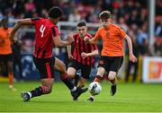 6 May 2023; Sam Dunne of St Kevin's FC is tackled by Josh Okagbue of Cherry Orchard FC during the FAI Under 17 Cup Final 2022/23 match between Cherry Orchard FC and St Kevin’s Boys FC at Richmond Park in Dublin. Photo by Tyler Miller/Sportsfile