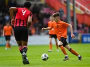 6 May 2023; Sam Dunne of St Kevin's FC in action against Josh Okagbue of Cherry Orchard FC during the FAI Under 17 Cup Final 2022/23 match between Cherry Orchard FC and St Kevin’s Boys FC at Richmond Park in Dublin. Photo by Tyler Miller/Sportsfile