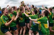 6 May 2023; Kerry players celebrate with the cup after the Electric Ireland Minor C All-Ireland Championship Final match between Down and Kerry at Clane GAA in Kildare. Photo by Stephen Marken/Sportsfile