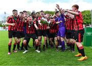 6 May 2023; Cherry Orchard FC players celebrate with the cup after their side's victory in the FAI Under 17 Cup Final 2022/23 match between Cherry Orchard FC and St Kevin’s Boys FC at Richmond Park in Dublin. Photo by Tyler Miller/Sportsfile