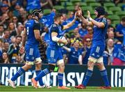6 May 2023; Jordan Larmour of Leinster celebrates with teammates Caelan Doris and Ryan Baird after scoring his side's third try during the United Rugby Championship Quarter-Final between Leinster and Cell C Sharks at the Aviva Stadium in Dublin. Photo by Harry Murphy/Sportsfile