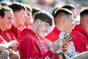 6 May 2023; Eoin Downey of Cork reads the match programme before the Munster GAA Hurling Senior Championship Round 3 match between Cork and Tipperary at Páirc Uí Chaoimh in Cork. Photo by David Fitzgerald/Sportsfile