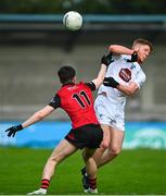 6 May 2023; Shane Farrell of Kildare is tackled by Oran Cunningham of Down during the Eirgrid GAA Football All-Ireland U20 Championship Semi-Final match between Kildare and Down at Parnell Park in Dublin. Photo by Tyler Miller/Sportsfile