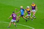 6 May 2023; Cian Boland of Dublin in action against Liam Óg McGovern, 12, Cathal Dunbar and Kevin Foley of Wexford, right,  during the Leinster GAA Hurling Senior Championship Round 3 match between Dublin and Wexford at Croke Park in Dublin. Photo by Ray McManus/Sportsfile