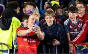 6 May 2023; Craig Casey of Munster with fans during the United Rugby Championship Quarter-Final match between Glasgow Warriors and Munster at Scotstoun Stadium in Glasgow, Scotland. Photo by Paul Devlin/Sportsfile