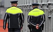 6 May 2023; Two gardai walk around the ground after the Leinster GAA Hurling Senior Championship Round 3 match between Dublin and Wexford at Croke Park in Dublin. Photo by Ray McManus/Sportsfile
