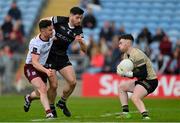 7 May 2023; Sligo goalkeeper Daniel Lyons wins possession as Ian Burke of Galway is tackled by Nathan Mullen of Sligo during the Connacht GAA Football Senior Championship Final match between Sligo and Galway at Hastings Insurance MacHale Park in Castlebar, Mayo. Photo by Ray McManus/Sportsfile