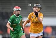 7 May 2023; Shannagh Heggarty of Antrim in action against Niamh Brennan of Limerick during the Electric Ireland Minor A Shield All-Ireland Championship Final match between Antrim and Limerick at UPMC Nowlan Park in Kilkenny. Photo by Stephen Marken/Sportsfile