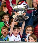 7 May 2023; Charlie, a son of manager Padraic Joyce, with his sister Jodie, right, lifts the Nestor Cup after the Connacht GAA Football Senior Championship Final match between Sligo and Galway at Hastings Insurance MacHale Park in Castlebar, Mayo. Photo by Ray McManus/Sportsfile