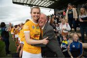 7 May 2023; Dervla McAulfield of Antrim celebrates with her grandfather Michael Crilly after the Electric Ireland Minor A Shield All-Ireland Championship Final match between Antrim and Limerick at UPMC Nowlan Park in Kilkenny. Photo by Stephen Marken/Sportsfile