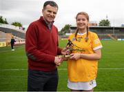 7 May 2023; Pictured is Orlaith McAllister of Antrim who was named the Electric Ireland player of the match by Pat Fenlon of Electric Ireland following her performance for Antrim in today’s Electric Ireland Camogie Minor A Shield All-Ireland Championship Final against Limerick at UPMC Nowlan Park in Kilkenny. Follow all the action in the Electric Ireland Camogie Minor Championships on social media @ElectricIreland and via the hashtag #ThisIsMajor, or for more information go to https://www.electricireland.ie/camogie-minor-championships. Photo by Stephen Marken/Sportsfile