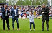 7 May 2023; Charlie Joyce, son of Galway manager Padraic Joyce, reacts to the crowd's applause as he stands beside members of the 1998 Galway Connacht championship winning team, from left, Tommy Joyce, Derek Savage and Niall Finnegan, before the Connacht GAA Football Senior Championship Final match between Sligo and Galway at Hastings Insurance MacHale Park in Castlebar, Mayo. Photo by Brendan Moran/Sportsfile