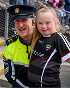 7 May 2023; Garda sergent James Canty with Sligo supporter Nova Clancy, from Gurteen, before the Connacht GAA Football Senior Championship Final match between Sligo and Galway at Hastings Insurance MacHale Park in Castlebar, Mayo. Photo by Ray McManus/Sportsfile
