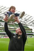 7 May 2023; Terenure managment Mark Hamilton lifts the trophy with his son Harry after the Energia All-Ireland League Men's Division 1A Final match between Clontarf and Terenure at the Aviva Stadium in Dublin. Photo by Harry Murphy/Sportsfile.